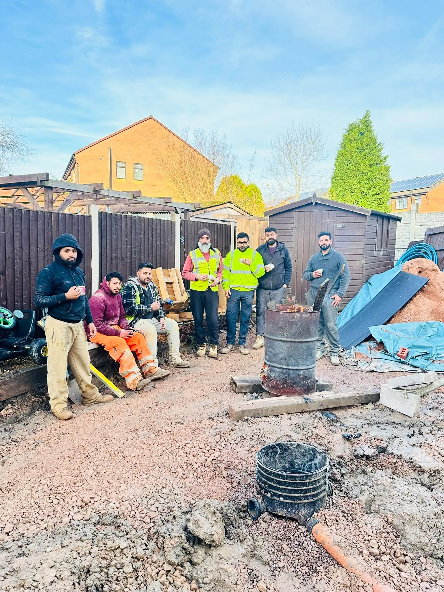 The Triple 1 team together on a building site