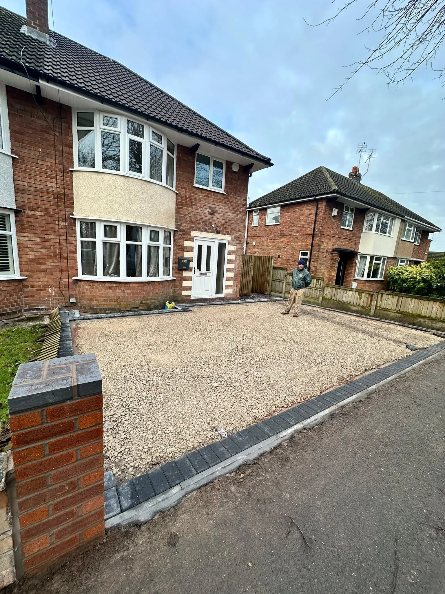Before: Front garden dug out and covered in a gravel base, ready for a new driveway