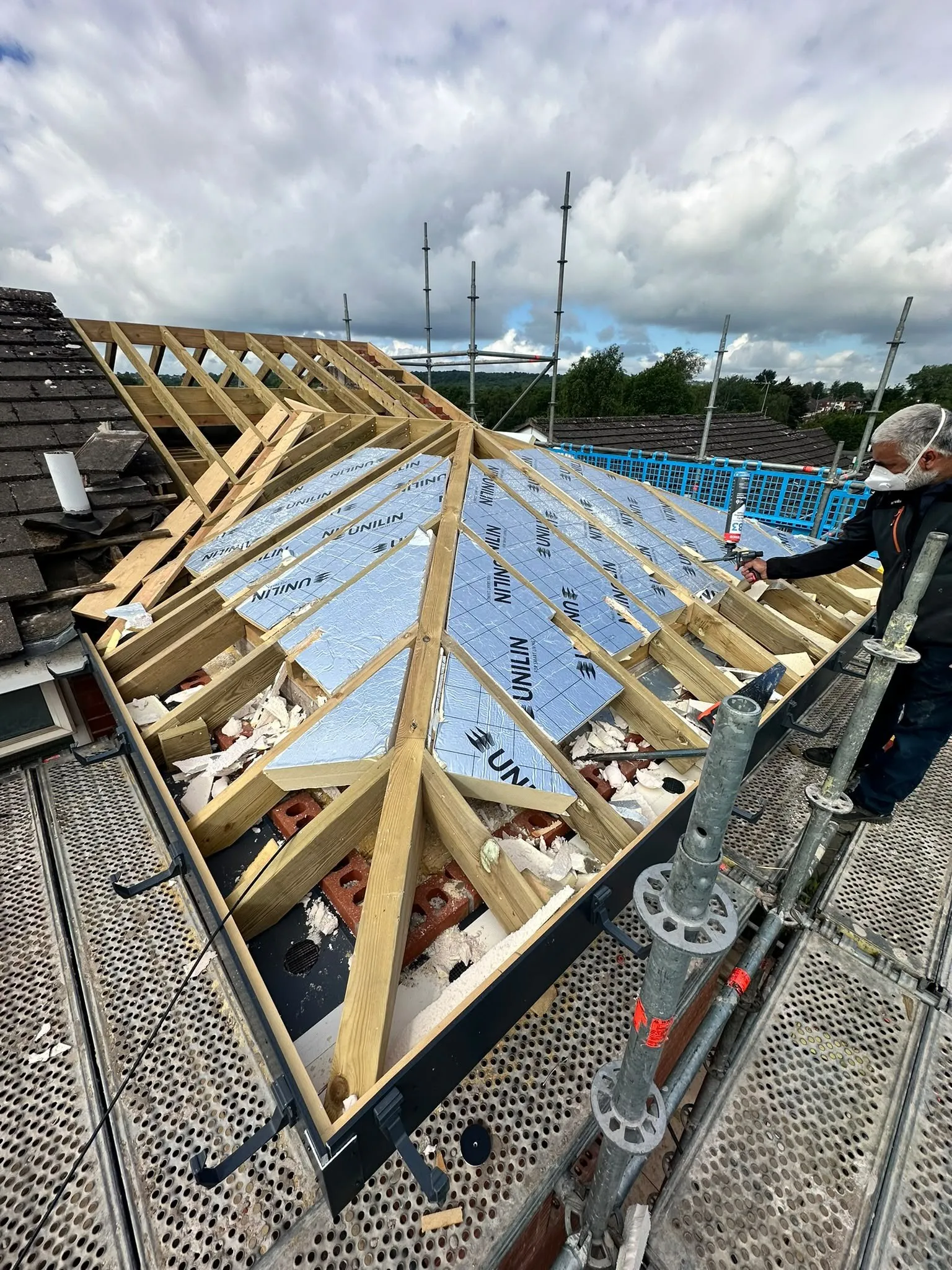 Insulation boards fitted between new roof timbers on an extension