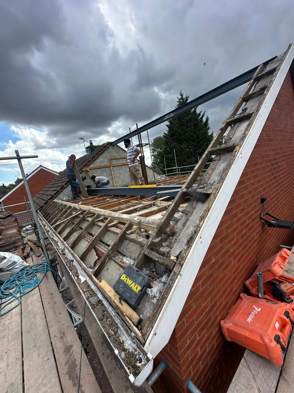 Old roof stripped to its timbers with a steel beam in place